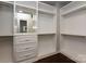 Spacious walk-in closet with custom shelving, drawers, and ample storage space at 8402 Aspen Ct, Charlotte, NC 28227