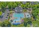 A beautiful aerial view of a community pool and clubhouse with lush landscaping at 9427 Gilpatrick Ln # 5, Huntersville, NC 28078