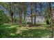 Spacious backyard with mature trees and manicured lawn, perfect for Gathering activities at 9427 Gilpatrick Ln # 5, Huntersville, NC 28078