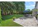 Backyard and patio with a dining set under an umbrella, grilling area, and green grass at 9427 Gilpatrick Ln # 5, Huntersville, NC 28078