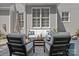 Outdoor living space features comfortable seating around a coffee table on a stamped concrete patio at 9427 Gilpatrick Ln # 5, Huntersville, NC 28078