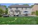 Spacious backyard with patio featuring dining, grilling, lounge area, and fire pit, perfect for outdoor living at 9427 Gilpatrick Ln # 5, Huntersville, NC 28078