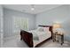 Bedroom with a full bed, end table and a window at 9427 Gilpatrick Ln # 5, Huntersville, NC 28078
