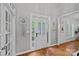 Bright foyer with hardwood floors, white trim, and decorative wall art creates an inviting entrance at 9427 Gilpatrick Ln # 5, Huntersville, NC 28078
