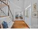 Elegant foyer with hardwood floors, staircase, and decorative French doors leading to other rooms at 9427 Gilpatrick Ln # 5, Huntersville, NC 28078