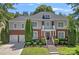 Charming two-story home featuring a well-manicured lawn, brick accents, and an inviting entryway at 9427 Gilpatrick Ln # 5, Huntersville, NC 28078