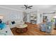 Open living room with hardwood floors, comfortable sofas, and view into the kitchen at 9427 Gilpatrick Ln # 5, Huntersville, NC 28078