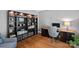 Inviting home office with custom shelving, hardwood floors, and ample natural light at 9427 Gilpatrick Ln # 5, Huntersville, NC 28078