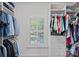 Organized walk-in closet with clothing racks, shelving, drawers and a window at 9427 Gilpatrick Ln # 5, Huntersville, NC 28078