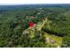 Aerial view showing the location of the neighborhood surrounded by lush green trees at 958 Hillard Ln, Lincolnton, NC 28092
