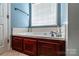 Bathroom featuring dark wood cabinets below a bright white jacuzzi tub at 958 Hillard Ln, Lincolnton, NC 28092