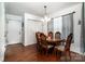 Comfortable dining room with hardwood floors, wood table, and chandelier lighting at 958 Hillard Ln, Lincolnton, NC 28092