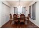 Bright dining room with hardwood floors, wood table, and closet space at 958 Hillard Ln, Lincolnton, NC 28092