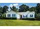 Inviting single-story house with white siding, blue shutters, and green lawn at 958 Hillard Ln, Lincolnton, NC 28092