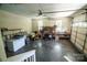 Spacious garage featuring storage shelving, lawn equipment, and ample room for vehicles and projects at 958 Hillard Ln, Lincolnton, NC 28092