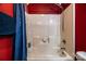 Red bathroom featuring a shower and mounted shower head at 958 Hillard Ln, Lincolnton, NC 28092