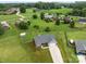 Expansive aerial view of the property featuring a large lot, charming home, and a well-kept lawn in a serene setting at 100 Royal Ave, Albemarle, NC 28001