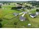 Expansive aerial view of a neighborhood showcasing homes with large, green yards and mature trees at 100 Royal Ave, Albemarle, NC 28001