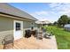 Relaxing back deck features a patio table and chairs, grill, and outdoor seating, perfect for entertaining guests at 100 Royal Ave, Albemarle, NC 28001