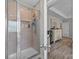 Modern bathroom features a glass enclosed shower with tile surround and built-in shelves at 100 Royal Ave, Albemarle, NC 28001