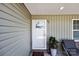 Inviting front porch with charming decor and a cozy seating area at 100 Royal Ave, Albemarle, NC 28001