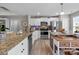 Gourmet kitchen features granite counters, stainless appliances, wood floors, and modern design great for cooking at 100 Royal Ave, Albemarle, NC 28001