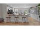 Bright eat-in kitchen boasts granite countertops, breakfast bar with seating and stainless steel appliances at 100 Royal Ave, Albemarle, NC 28001