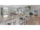 Open concept kitchen features granite countertops, breakfast bar with seating and custom cabinets at 100 Royal Ave, Albemarle, NC 28001
