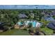 Aerial view of neighborhood pool, clubhouse, green trees, and a pond nearby at 1112 Wagner Ave # 335, Fort Mill, SC 29715