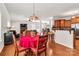 Bright dining area next to the living room and open to the kitchen; features hardwood floors at 1112 Wagner Ave # 335, Fort Mill, SC 29715