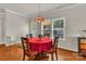 Bright dining nook with backyard views and a stylish stained glass light fixture overhead at 1112 Wagner Ave # 335, Fort Mill, SC 29715