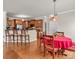 Open kitchen and dining area featuring hardwood floors and counter seating at 1112 Wagner Ave # 335, Fort Mill, SC 29715
