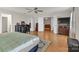 Spacious main bedroom with wood floors, a ceiling fan and many bright windows at 1112 Wagner Ave # 335, Fort Mill, SC 29715