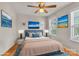 Brightly staged main bedroom with ocean art, hardwood floors, a ceiling fan, and sunny exposure at 1112 Wagner Ave # 335, Fort Mill, SC 29715