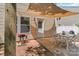 Backyard patio with white table and chairs under a shade, next to the house at 1112 Wagner Ave # 335, Fort Mill, SC 29715