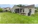 Charming backyard with a screened patio, garden beds, and plenty of green space for outdoor enjoyment at 1116 Arnott Ln, Matthews, NC 28105
