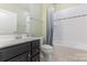 Full bathroom with single sink vanity, white toilet and shower with tub at 1116 Arnott Ln, Matthews, NC 28105