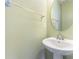Light and airy bathroom with a pedestal sink and neutral wall color at 1116 Arnott Ln, Matthews, NC 28105