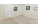 Comfortable bedroom featuring neutral carpet and two white doors with inspirational wall art at 1116 Arnott Ln, Matthews, NC 28105