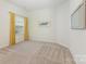 Cozy bedroom with neutral carpet, large window with yellow curtains, and ample natural light at 1116 Arnott Ln, Matthews, NC 28105