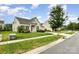 Well-maintained single-story home on a green lawn, showcasing its neat landscaping and inviting curb appeal at 1116 Arnott Ln, Matthews, NC 28105