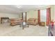 Spacious living room with plush seating, carpet, and ample natural light at 1116 Arnott Ln, Matthews, NC 28105