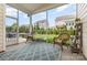 Charming screened porch with a seating area and view of the landscaped backyard at 1116 Arnott Ln, Matthews, NC 28105