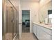 Bathroom featuring a tiled shower and double sink vanity, providing a luxurious and functional space at 11807 Midnight Way, Huntersville, NC 28078