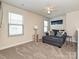 Bonus room providing a comfortable seating area, and featuring carpeted floors at 11807 Midnight Way, Huntersville, NC 28078