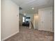 Carpeted bonus room offers a versatile space, perfect for recreation or relaxation at 11807 Midnight Way, Huntersville, NC 28078