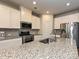 Well-lit kitchen with granite countertops, stainless steel appliances, and ample cabinet space at 11807 Midnight Way, Huntersville, NC 28078