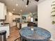 Open-concept kitchen with granite counters flowing into the living and dining areas at 11807 Midnight Way, Huntersville, NC 28078