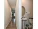 Powder room view showcasing a pedestal sink and decorative round mirror at 11807 Midnight Way, Huntersville, NC 28078