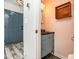 Stylish half bathroom with unique fixtures and a view of the entry at 12250 Wallace Ridge Dr, Charlotte, NC 28269